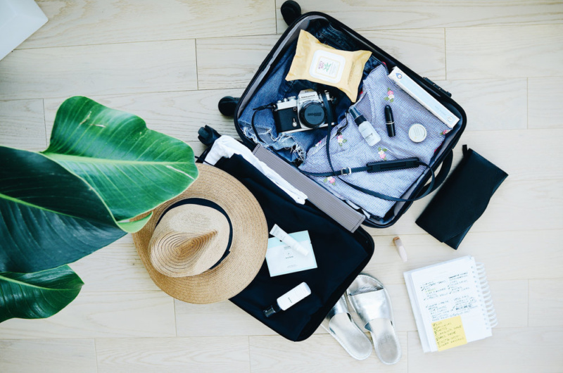 A suitcase open on bed